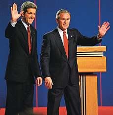 President George W. Bush, right, and Democratic presidential candidate Sen. John Kerry, D-Mass., wave as they enter the stage before the third and final presidential debate Wednesday in Tempe, Ariz. AP Photo.