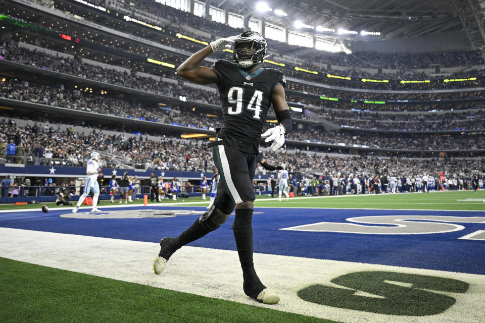 Dec 24, 2022; Arlington, Texas, USA; Philadelphia Eagles defensive end Josh Sweat (94) waves to the crowd after he scores a touchdown on interception against Dallas Cowboys quarterback Dak Prescott (not pictured) during the first quarter at AT&T Stadium. Mandatory Credit: Jerome Miron-USA TODAY Sports