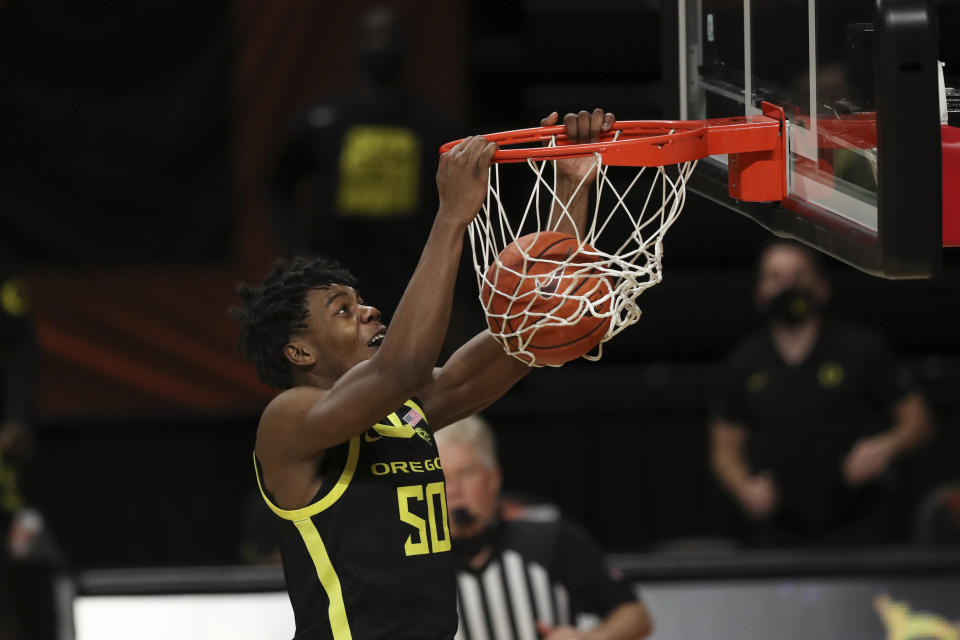 Oregon's Eric Williams Jr. (50) dunks against Oregon State during the second half of an NCAA college basketball game in Corvallis, Ore., Sunday, March 7, 2021. (AP Photo/Amanda Loman)