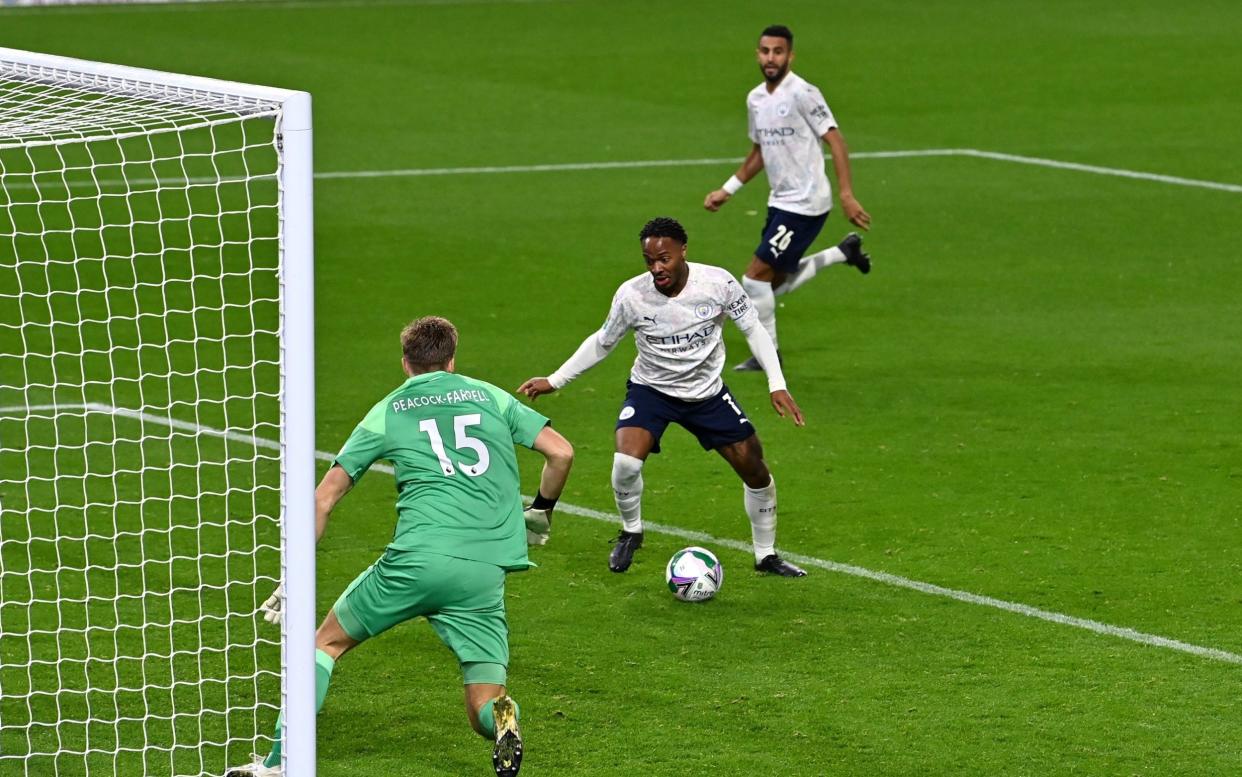 Raheem Sterling of Manchester City scores his side's second goal during the Carabao Cup fourth round match between Burnley and Manchester City at Turf Moor - Pool/Getty