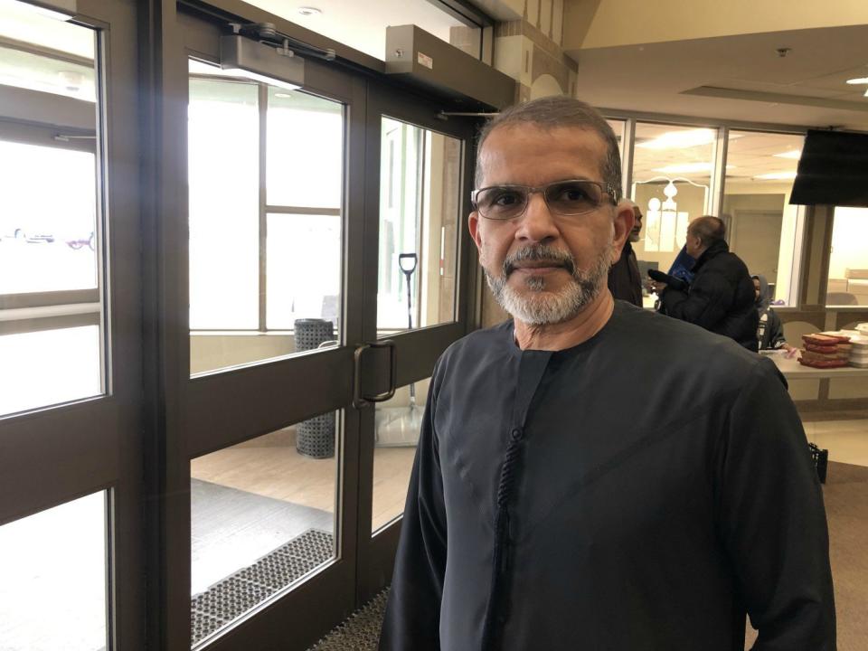 Fareed Amin, president of the Islamic Institute of Toronto, stands near the entrance to the mosque before Friday prayers. 