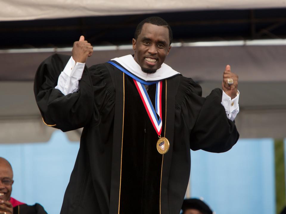 Sean "Diddy" Combs gives a thumbs up after his commencement speech at Howard University