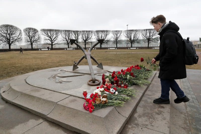 People mourn and lay flowers at a memorial remembering the victims of the terrorist attack at the Crocus City Hall near Moscow in St. Petersburg, Russia, on Saturday. The head of the Russian FSB, Alexander Bortnikov, reported to Russian President Vladimir Putin on Saturday the arrest of 11 people, including all four terrorists directly involved in the terrorist attack. Photo by Anatoly Maltsev/EPA-EFE