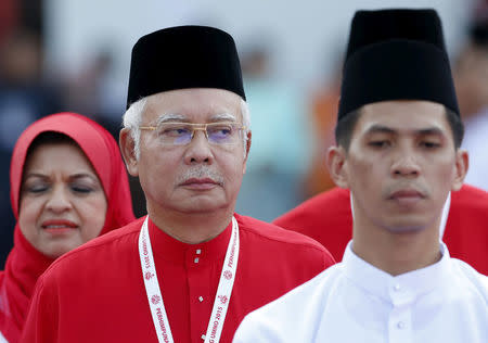 Malaysia's Prime Minister Najib Razak inspects the United Malays National Organisation (UMNO) youth during the annual assembly at the Putra World Trade Centre in Kuala Lumpur, Malaysia, December 10, 2015. REUTERS/Olivia Harris/Files