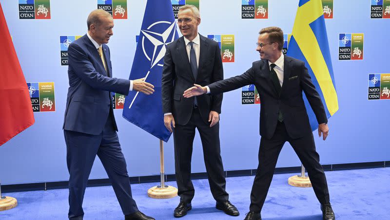 Turkish President Recep Tayyip Erdogan, left, and Swedish Prime Minister Ulf Kristersson shake hands next to NATO Secretary-General Jens Stoltenberg prior to their meeting, on the eve of a NATO summit, in Vilnius, Monday, July 10, 2023. Erdogan’s abrupt approval of Sweden’s NATO bid came after a year of objections to Stockholm to joining the defense alliance.