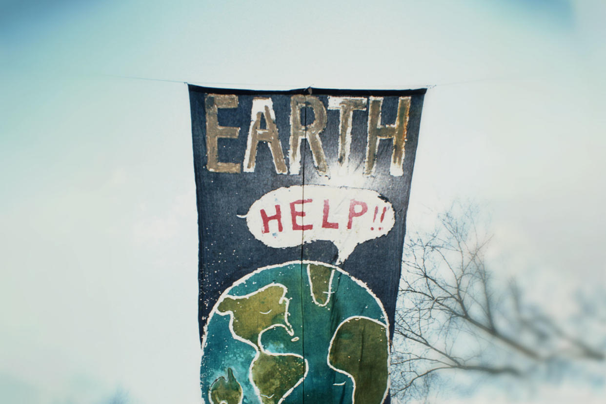 A banner at the inaugural Earth Day depicting the earth calling out for help, New York City, 22nd April 1970. Archive Photos/Getty Images