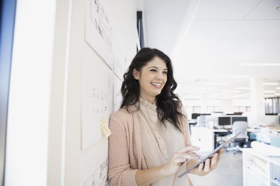 Confident young woman at work