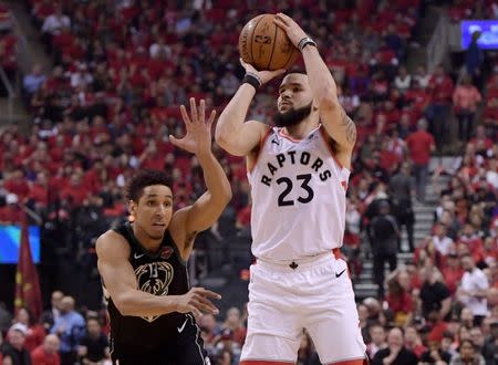 May 25, 2019; Toronto, Ontario, CAN; Toronto Raptors guard Fred VanVleet (23) shoots the ball past Milwaukee Bucks guard Malcolm Brogdon (13) in the first half of game six of the Eastern Conference final at Scotiabank Arena. Dan Hamilton-USA TODAY Sports