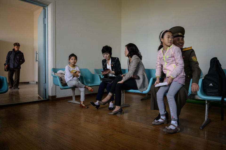 A photo taken on September 13, 2019 shows passengers in the departure area of the airport in North Korea's northern city of Samjiyon. - The monumental construction project in the far reaches of North Korea ordered by leader Kim Jong Un, involves nothing less than the rebuilding of the entire town of Samjiyon, the seat of a county which includes the supposed birthplace of Kim's father and predecessor Kim Jong Il, and Mount Paektu, the spiritual birthplace of the Korean nation. The plan includes a museum of revolutionary activities, a winter sports training complex, processing plants for blueberries and potatoes -- two of the area's most important crops -- a new railway line to Hyesan, and 10,000 apartments. (Photo by Ed JONES / AFP) / To go with NKorea-politics-economy-construction-Samjiyon, FOCUS by Sebastien Berger        (Photo credit should read ED JONES/AFP via Getty Images)