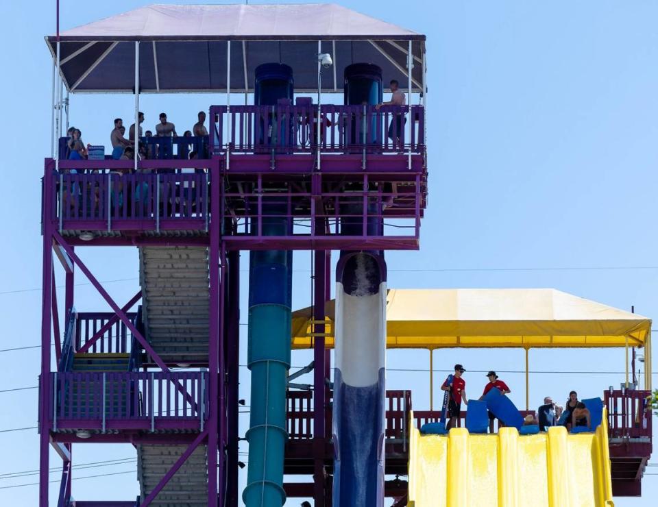 People wait in line for water slides on Friday, June 21.