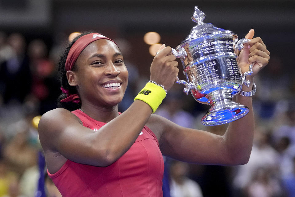 FILE - Coco Gauff, of the United States, holds up the championship trophy after defeating Aryna Sabalenka, of Belarus, in the women's singles final of the U.S. Open tennis championships, Saturday, Sept. 9, 2023, in New York. The Australian Open will mark Gauff's first Grand Slam tournament since winning her first major trophy at the U.S. Open in September. Play begins in Melbourne on Sunday morning (Saturday night ET). (AP Photo/Frank Franklin II, File)