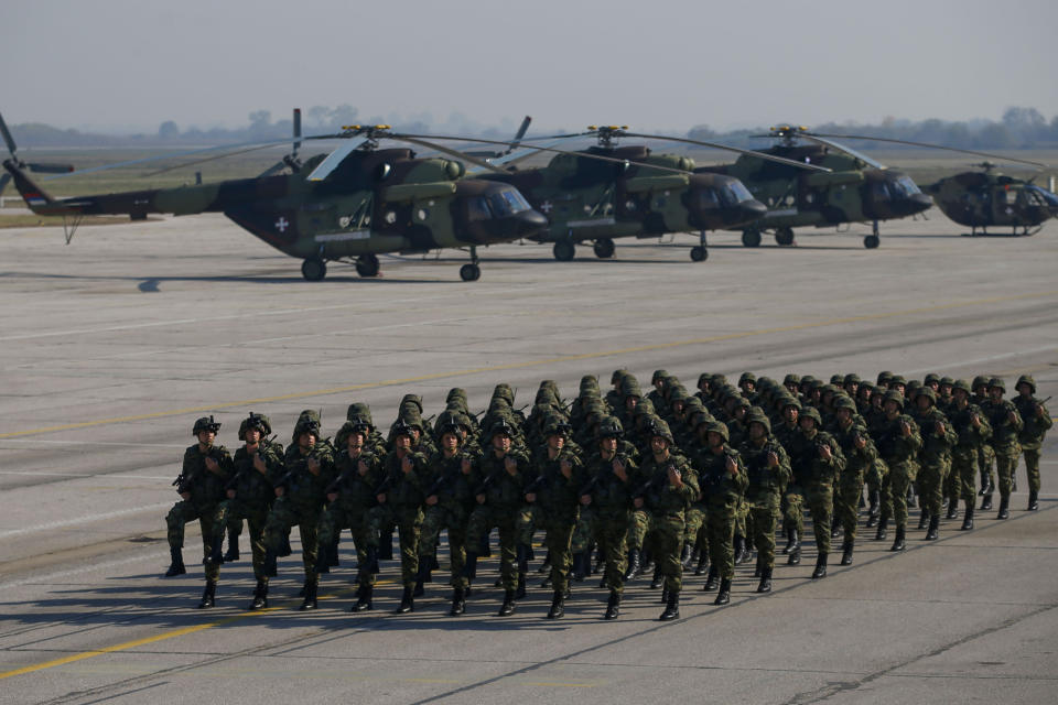 FILE - Serbian Army soldiers perform during a military parade at the military airport Batajnica, near Belgrade, Serbia, on Oct. 19, 2019. Serbia looks set to reintroduce the obligatory military service for its young citizens, the army command said Thursday, Jan. 4, 2024 in a move that comes amid rising tensions in the Balkans. (AP Photo/Darko Vojinovic, File)