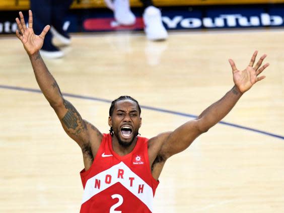 Kawhi Leonard celebrates victory for the Raptors (AP)