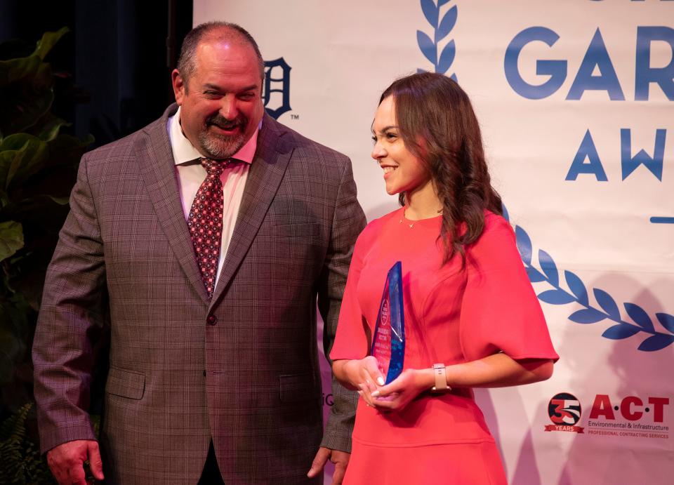 Superintendent of Schools Frederick Heid presents Jacqueline Patton of Central Florida Aerospace Academy with the Silver Garland Award for Athletics.