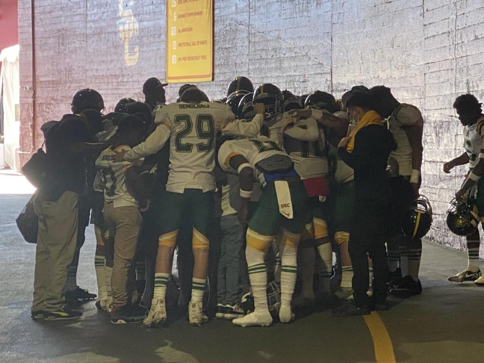 Jefferson football players gather in the tunnel at the Coliseum before their game against Manual Arts.