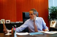 IAEA Director General Grossi checks some papers in his office in Vienna