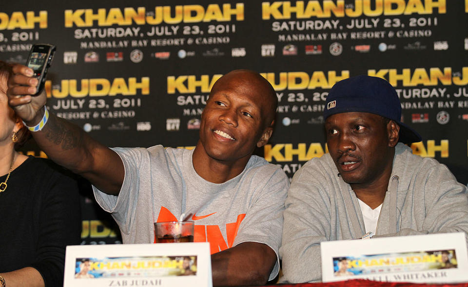 LOS ANGELES, CA – JUNE 08: Zab Judahtakes a cell phone picture of himself with trainer Pernell Whitaker as they appear at a press conference with Amir Khan to discuss their upcoming Super Lightweight World Championship Unification Fight at ESPN Zone At L.A. Live on June 8, 2011 in Los Angeles, California. (Photo by Stephen Dunn/Getty Images)