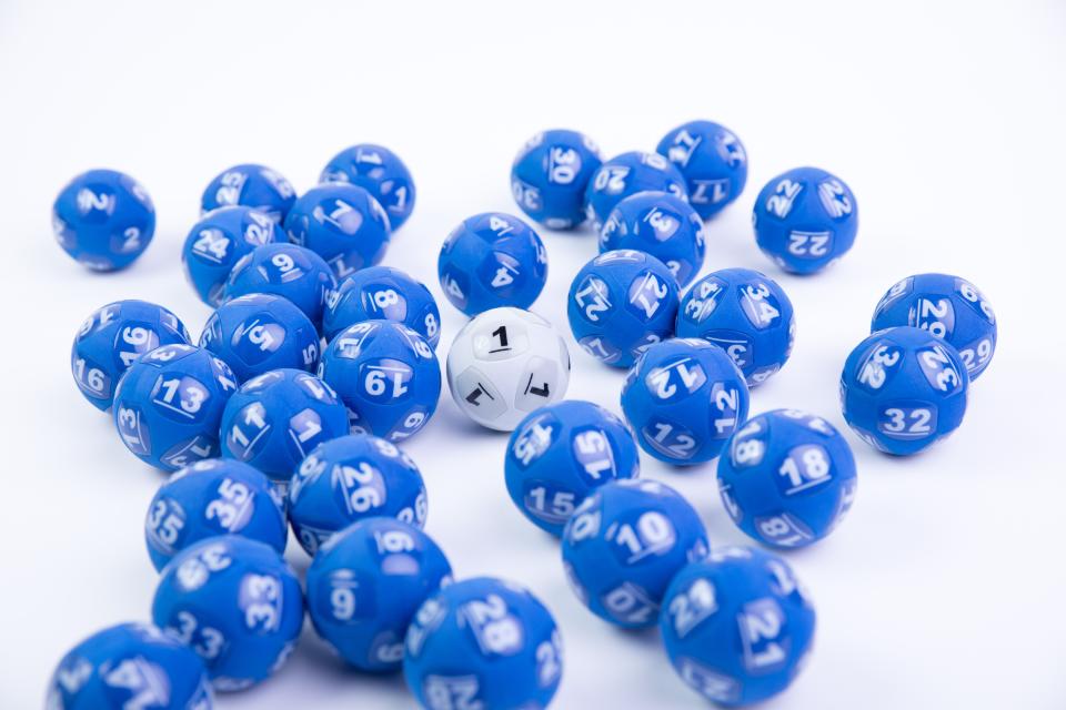 Pictured is blue and white lottery balls, tonight's Powerball Jackpot has reached $20 million.