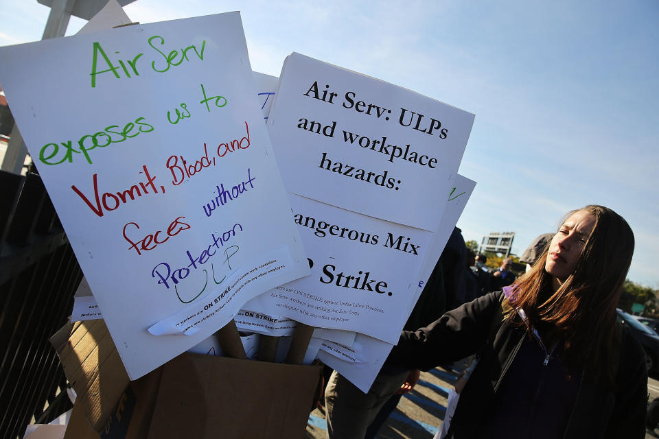 On October 9, 2014, nearly 200 airline cabin cleaners walk on a picket line at LaGuardia International Airport after going on strike overnight out of concern over health and safety issues including the possible exposure to the Ebola virus.