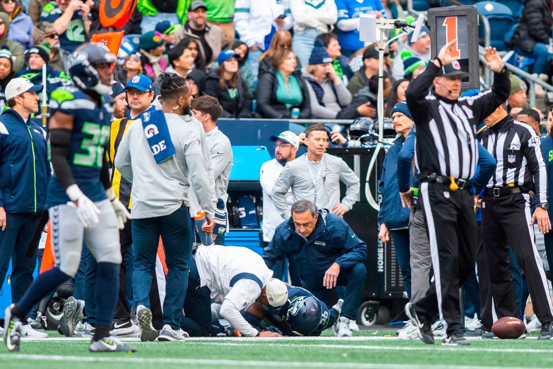 Seattle Seahawks linebacker Jordyn Brooks (56) lies on the field after being injured in the second quarter of an NFL game against the New York Jets at Lumen Field in Seattle Wash. on Jan. 1, 2023. The Seahawks defeated the Jets 23-6.