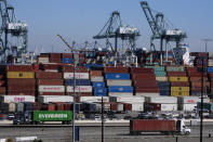 Cargo containers sit stacked at the Port of Los Angeles, Wednesday, Oct. 20, 2021, in San Pedro, Calif. California Gov. Gavin Newsom on Wednesday issued an order that aims to ease bottlenecks at the ports of Los Angeles and Long Beach that have spilled over into neighborhoods where cargo trucks are clogging residential streets. (AP Photo/Ringo H.W. Chiu)