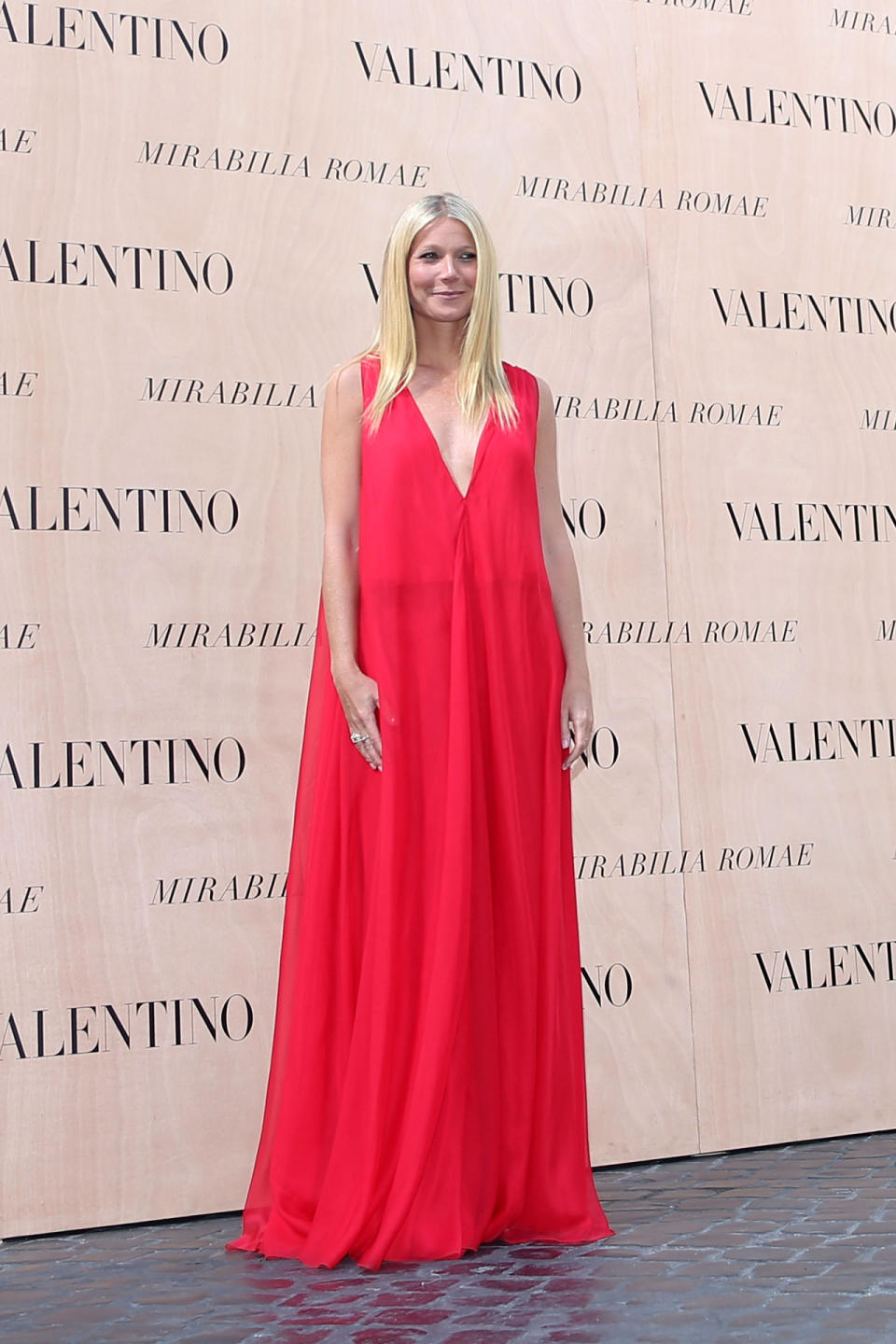 <p>Gwyneth Paltrow, a “friend of the house,” as <a rel="nofollow noopener" href="https://twitter.com/MaisonValentino/status/619241884540497920" target="_blank" data-ylk="slk:Valentino tweeted;elm:context_link;itc:0;sec:content-canvas" class="link ">Valentino tweeted</a>, wore a red dress to take in the haute couture clothes come down the runway. Sitting with Maison Valentino himself and the designer’s partner Giancarlo Giammetti, the Goop.com founder encapsulated summer simplicity in an elevated maxi dress, her hair styled stick straight, natural makeup, and no jewelry.</p>