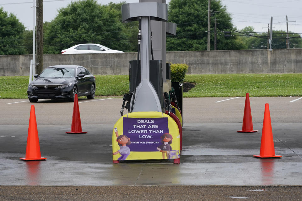 Safety cones block access to the fuel pumps at this closed Kroger fuel station, Wednesday, May 12, 2021, in Jackson, Miss. State officials warned Tuesday that any shortages seen at individual gas stations are a result of people "panic buying", not the Colonial Pipeline shutdown itself, and call on residents to limit unnecessary travel and only buy as much gasoline as they need. (AP Photo/Rogelio V. Solis)