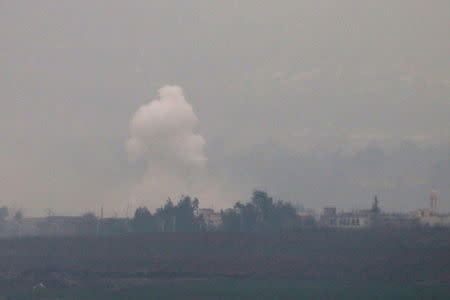 Smoke rises from shells fired from Israel over Al Wazzani area in southern Lebanon, January 4, 2016. REUTERS/Karamallah Daher