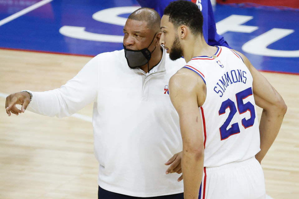 PHILADELPHIA, PENNSYLVANIA - APRIL 28: Head coach Doc Rivers of the Philadelphia 76ers speaks with Ben Simmons #25 during the first quarter against the Atlanta Hawks at Wells Fargo Center on April 28, 2021 in Philadelphia, Pennsylvania. NOTE TO USER: User expressly acknowledges and agrees that, by downloading and or using this photograph, User is consenting to the terms and conditions of the Getty Images License Agreement. (Photo by Tim Nwachukwu/Getty Images)