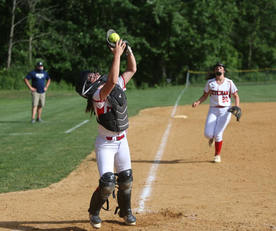 Ketcham's Paige Hotle catches a pop up behind the plate during a June 1, 2021 softball game against Beacon.