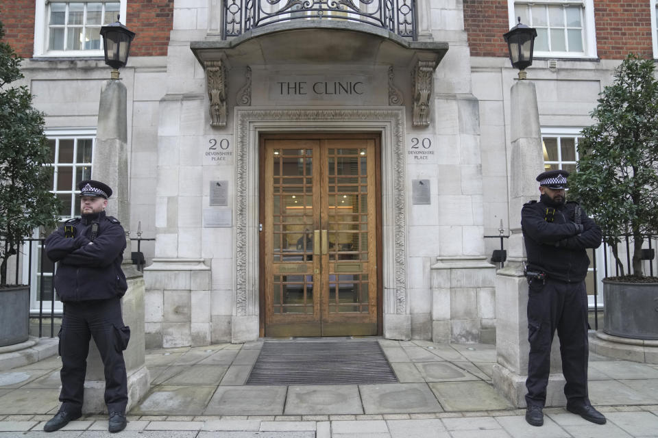 FILE - Police officers stand guard outside The London Clinic where Kate, Princess of Wales is recovering from surgery, in London, Wednesday, Jan. 17, 2024. A British privacy watchdog said Wednesday, March 20, 2024, it is looking into a report that staff at a private London hospital tried to access the Princess of Wales’ medical records while she was a patient for abdominal surgery. (AP Photo/Kin Cheung, File)