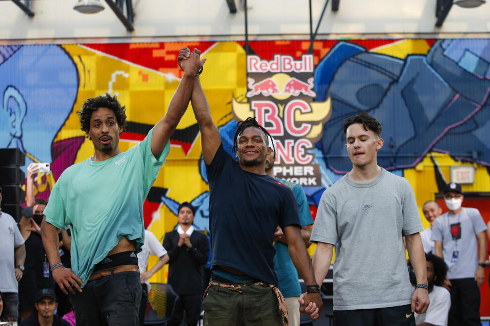 Red Bull BC One All Star Neguin, raises up the hand of B-boy Frankie, left, as he win the competition against uncle Will during Red Bull BC One event on, Saturday, July 24, 2021. in New York. Many in the breaking community are eager for the art form to expand its audience after the International Olympic Committee announced that it would become an official sport at the Paris 2024 games. But that optimism is hardly unanimous. (AP Photo/Eduardo Munoz Alvarez)