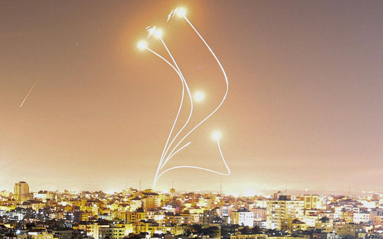 Israel's Iron Dome air defence system intercepts rockets launched from Gaza City - MAHMUD HAMS/AFP