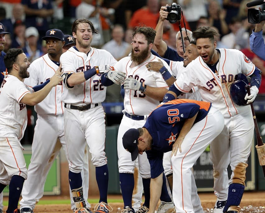 Astros DH Tyler White (middle) launched MLB’s record-setting 81st walk-off home run of the season. (AP)