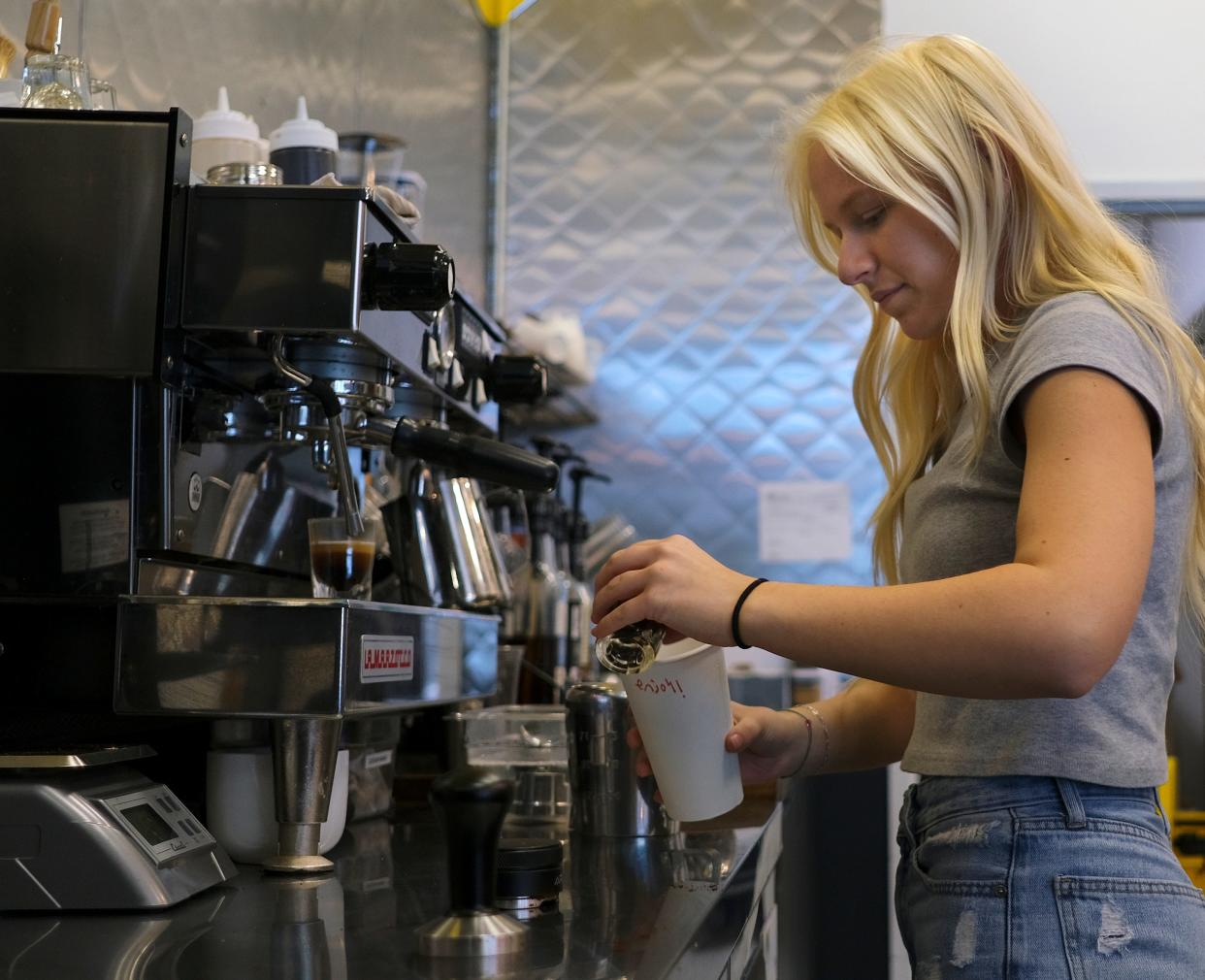 Taylor Kinther creates a drink at the Not Your Average Joe location attached to the Ronald J. Norick Downtown Library in Oklahoma City. The midtown location will take part in $10 Lunch Week Aug. 21-25.