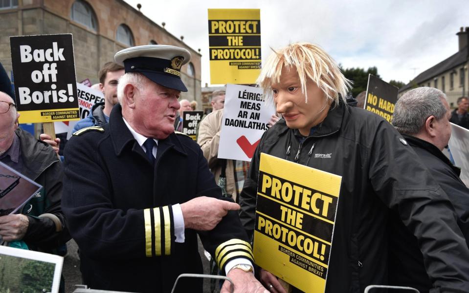 Protesters gathered as Boris Johnson met political leaders in Northern Ireland on Monday - Charles McQuillan/Getty Images