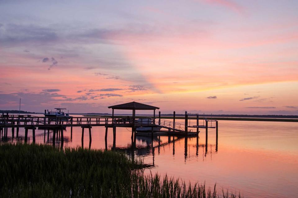 Gorgeous Hilton Head Island sunset silhouettes docks on Broad Creek which is on the west side of the island