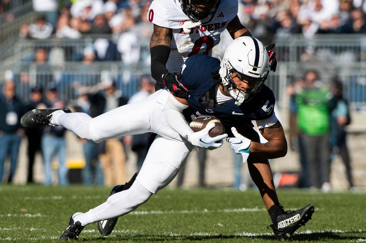 Penn State wide receiver Omari Evans (5) catches a pass over the middle of the field during an NCAA football game against Rutgers Saturday, Nov. 18, 2023, in State College, Pa. The Nittany Lions won, 27-6.