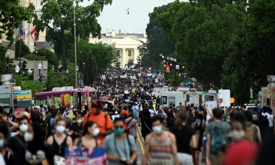 Demonstrators march on 16th Street near the White House on Saturday.