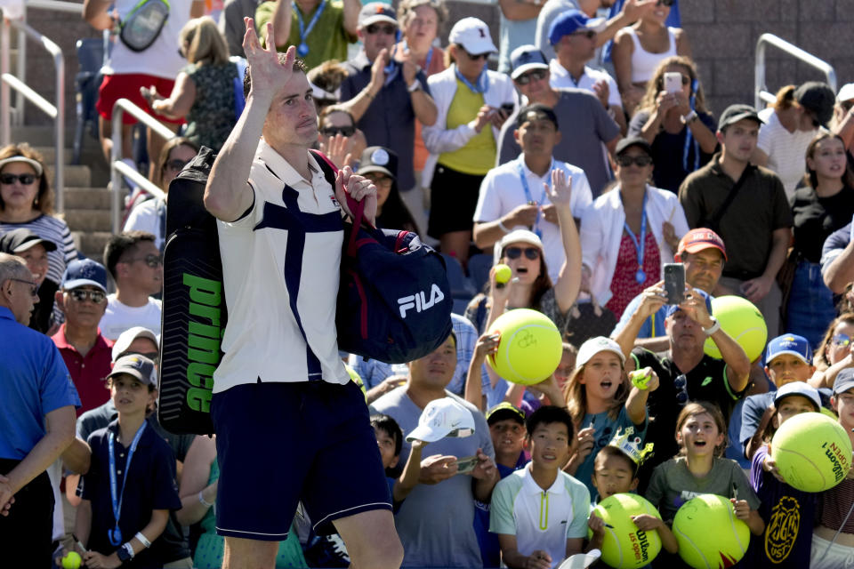 John Isner, of the United States, reacts after losing to Michael Mmoh, of the United States, during the second round of the U.S. Open tennis championships, Thursday, Aug. 31, 2023, in New York. (AP Photo/John Minchillo)