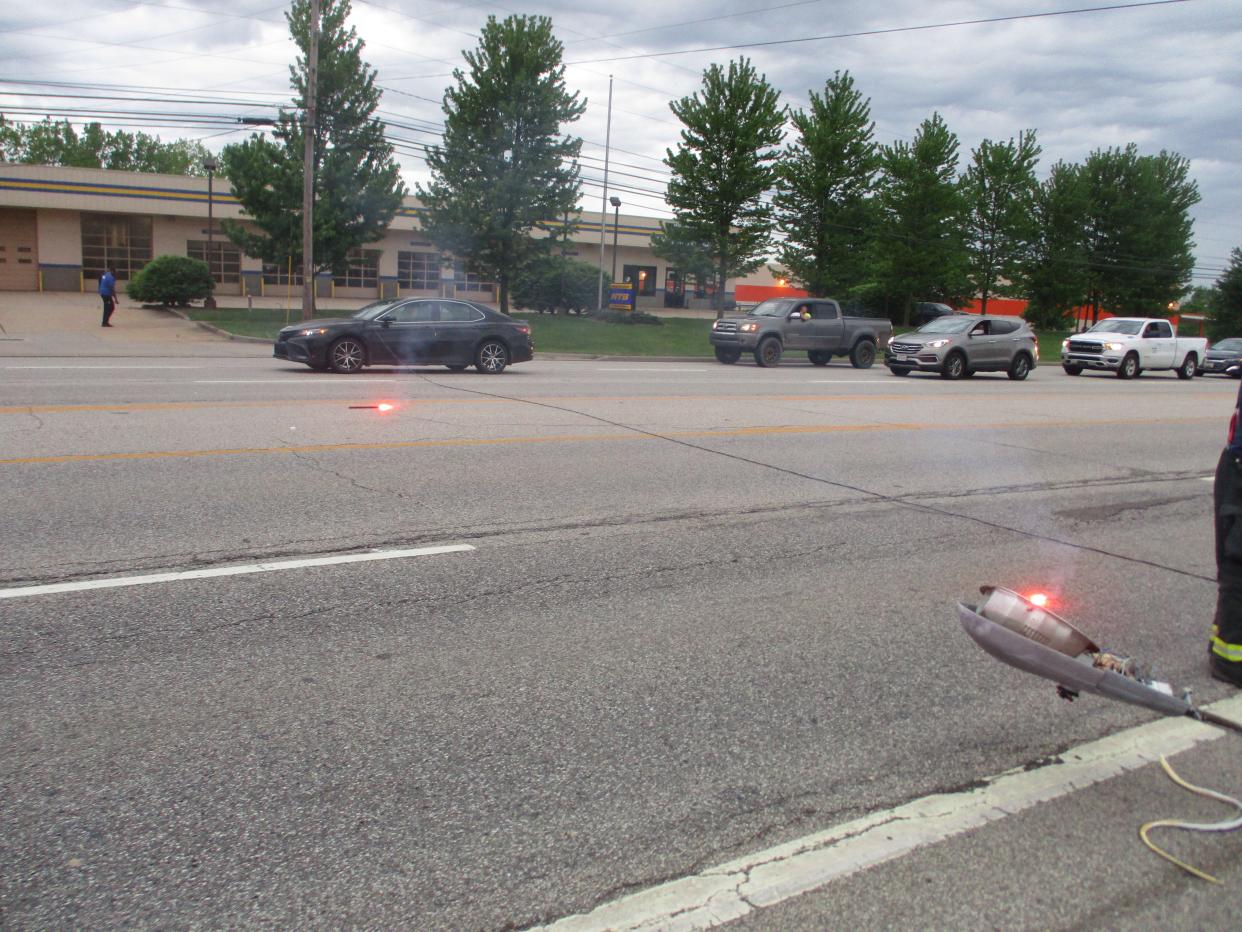 After a utility pole was struck by another car, a live wire fell onto this Toyota Camry on State Route 14 in Streetsboro Thursday morning, between State Route 303 and Mondial Parkway. No injuries were reported to the driver, a Twinsburg woman.