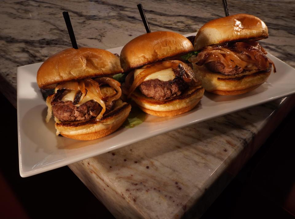 The sliders at the new Arigna Irish Pub & Coal Fire Kitchen come three to an order and are smothered in cheese and caramelized onions. [The Providence Journal / Sandor Bodo]