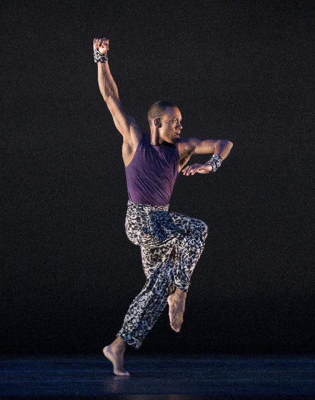 This publicity image released by Alvin Ailey American Dance Theater shows Kirven James Boyd performing in "Four Corners, choreographed by Ronald K. Brown, at Lincoln Center’s David H. Koch Theater in New York. (AP Photo/Alvin Ailey American Dance Theater, Paul Kolnik)