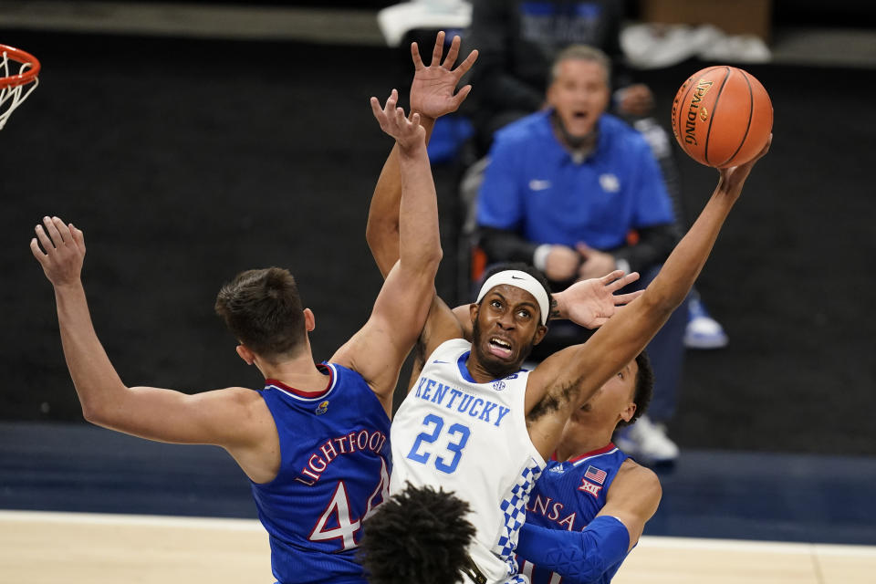 FILE - In this Dec. 1, 2020, file photo, Kentucky's Isaiah Jackson (23) grabs a rebound next to Kansas' Mitch Lightfoot (44) during an NCAA college basketball game in Indianapolis. Jackson was selected in the first round of the NBA draft Thursday, July 29. (AP Photo/Darron Cummings, File)