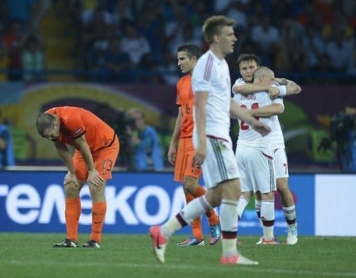 Danish players celebrate after winning their Euro 2012 Group B match against the Netherlands, in Kharkiv. Denmark won 1-0