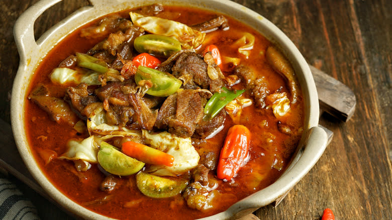 Goat stew with tomatoes and peppers