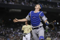 Los Angeles Dodgers catcher Will Smith watches the ball before making the catch for the out on a popup by Arizona Diamondbacks' Nick Ahmed (13) during the second inning of a baseball game Friday, July 30, 2021, in Phoenix. (AP Photo/Rick Scuteri)