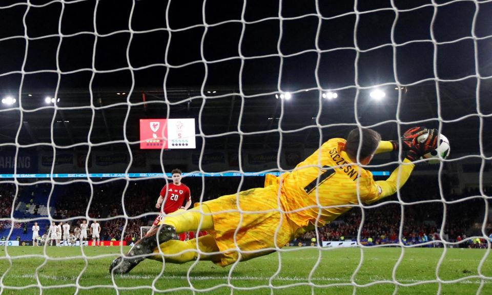 <span>Wojciech Szczesny saves Daniel James’s penalty in the shootout to to earn Poland a place at Euro 2024.</span><span>Photograph: Molly Darlington/Reuters</span>