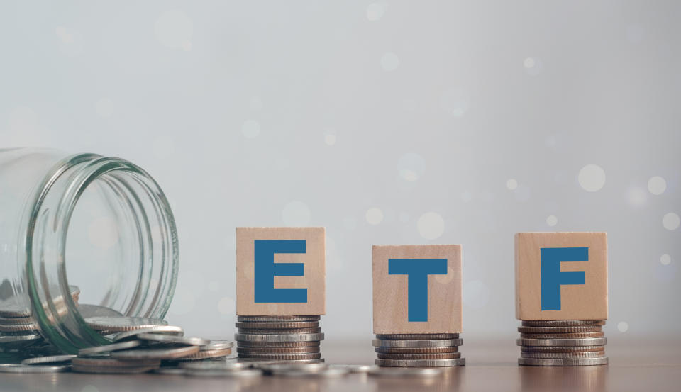 ETF (Exchange Traded Fund), business/finance. Wooden cubes with the letters ETF arranged in a vertical pyramid. ETF - short for Exchange-Traded Fund, business concept.