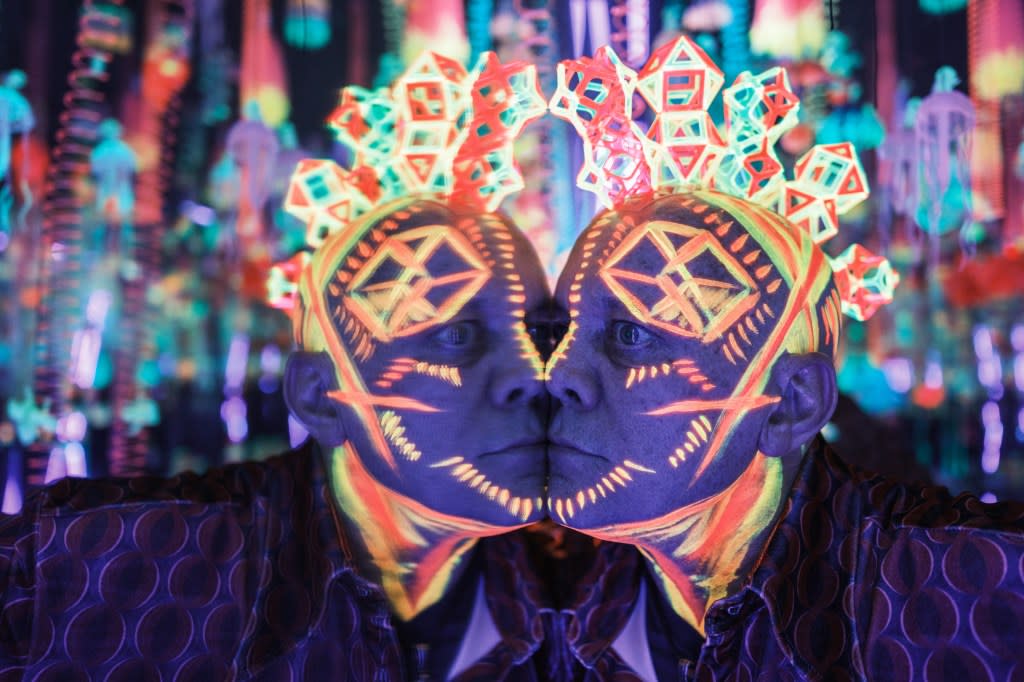 Chris Wink models a blacklight reactive sacred geometry headpiece by Max Steiner and glowing face paint by Renee Orshan. Stephen Yang